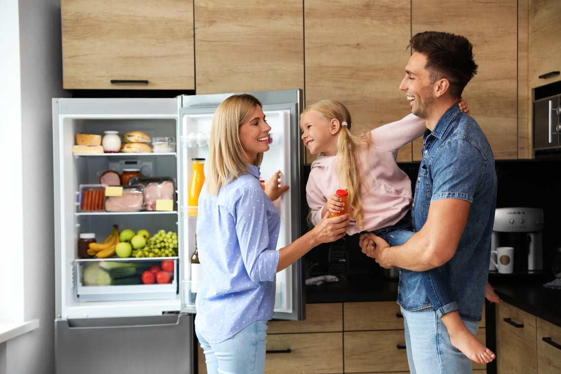 Happy Family With Fridge