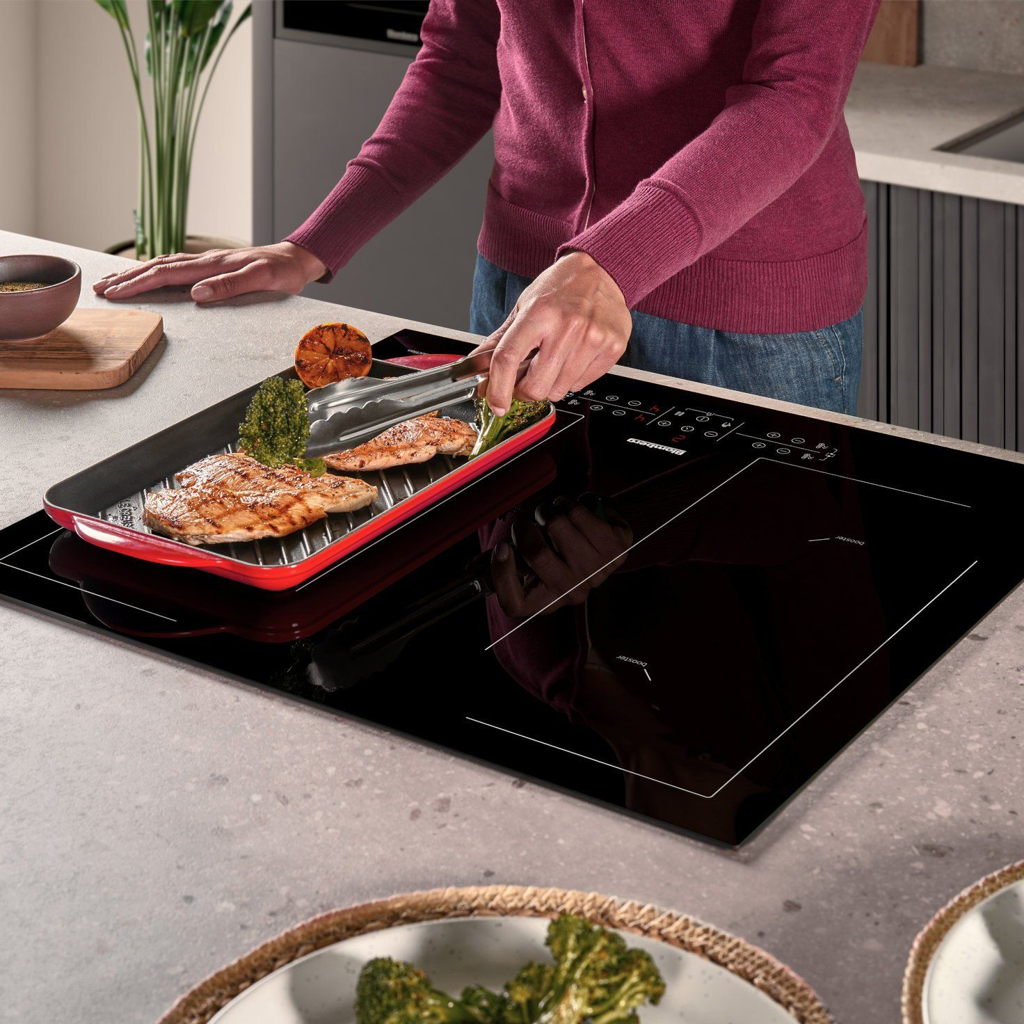 Lady cooking on hob