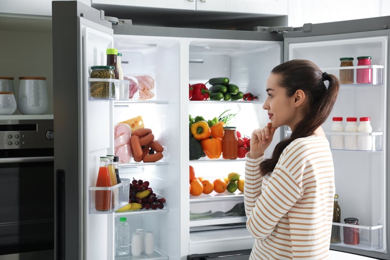Woman looking in fridge